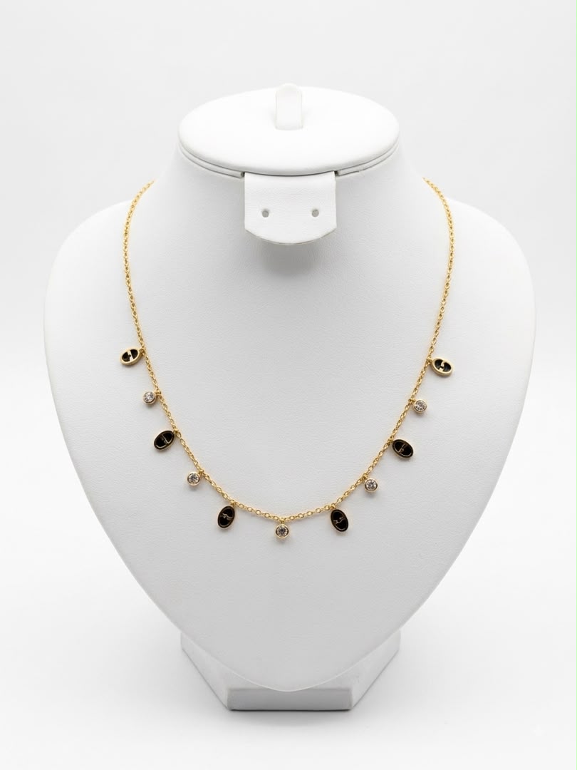 Collier ovales noirs et zircons dorés