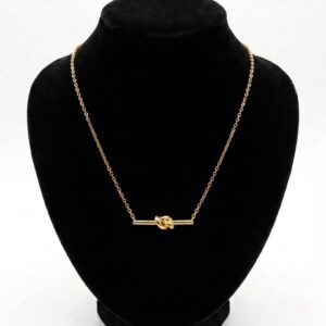 Collier pendentif barre et nœud doré